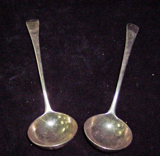 Appraisal: A pair of George III sauce ladles of Old English