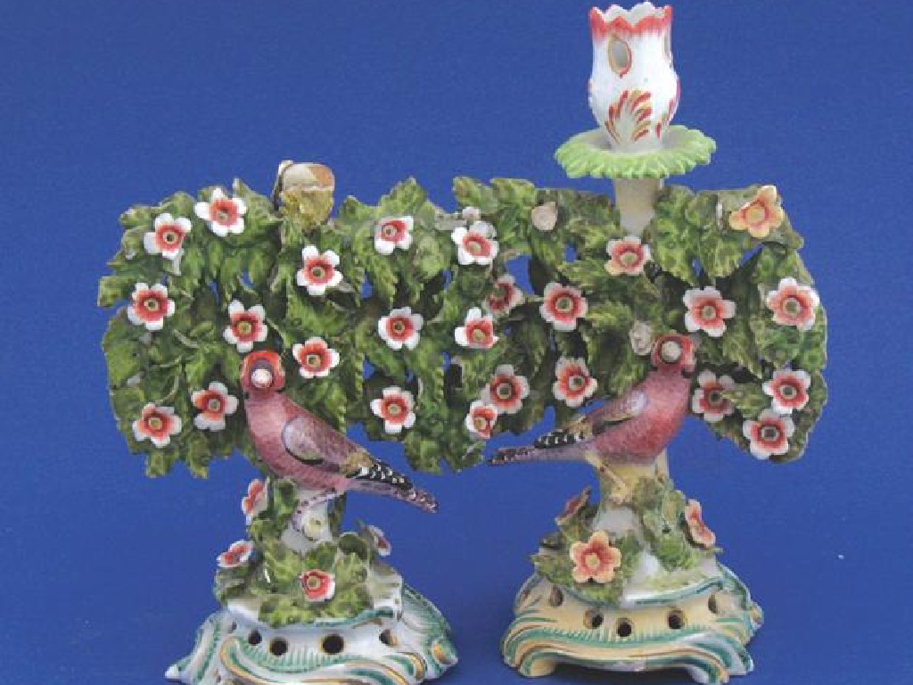 Appraisal: A PAIR OF BOW BOCAGE CANDLESTICKS modelled as birds with