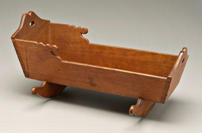 Appraisal: Dovetailed doll cradle cherry throughout cusped ends with open handles