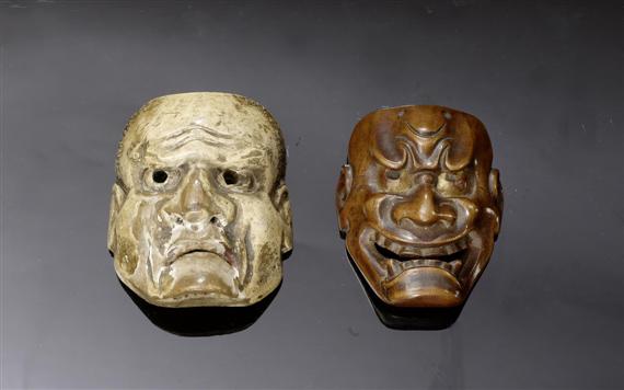 Appraisal: TWO MASK-NETSUKE OF DEMONS CARVED WOOD PARTLY IN COLOUR ONE