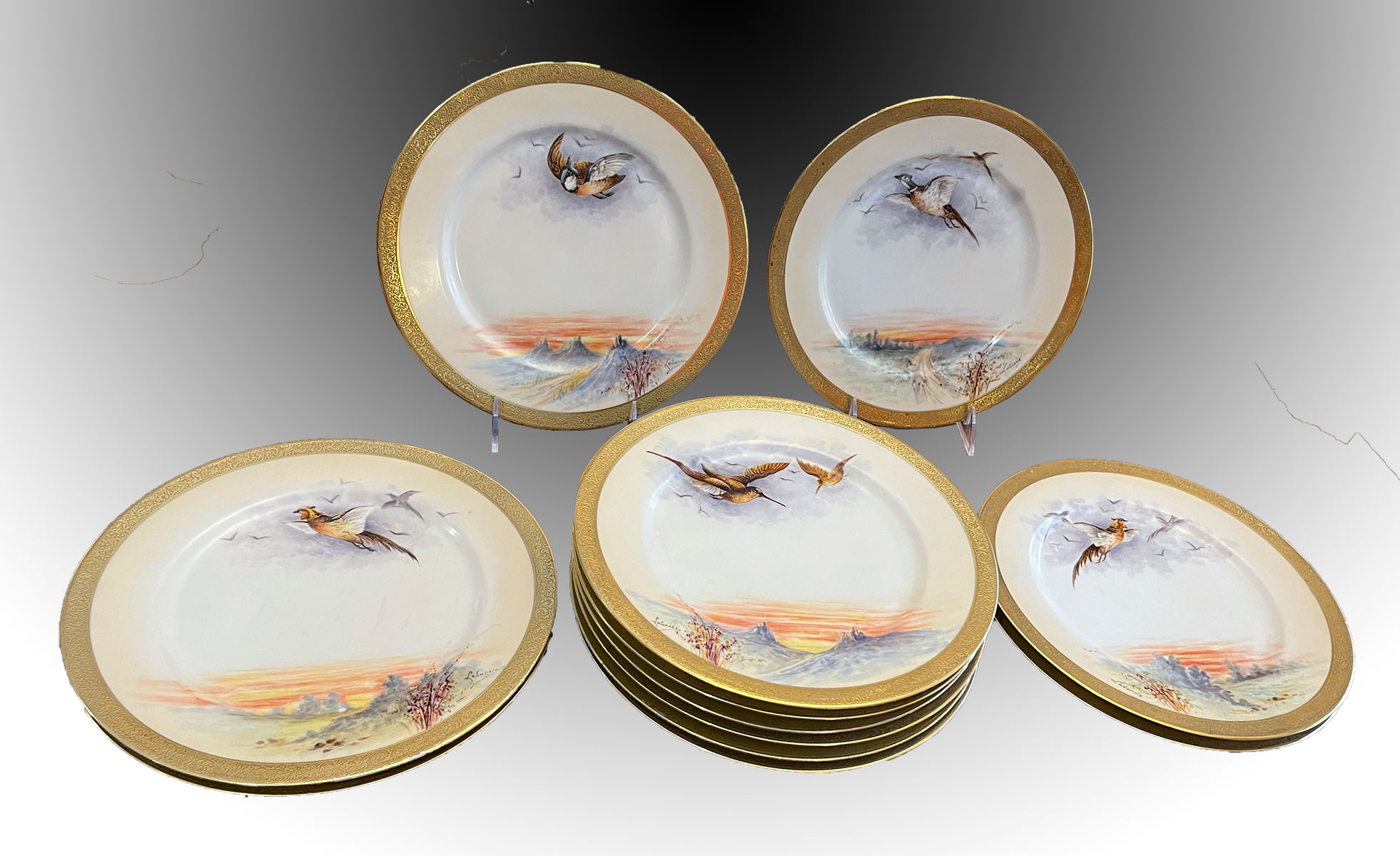 Appraisal: G DEMARTINE CIE LIMOGES HAND DECORATED BIRD MOTIF PLATES Artist