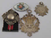 Appraisal: A Norwegian enamelled silver brooch two silver pendants and a