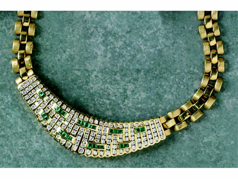 Appraisal: DIAMOND AND EMERALD NECKLACE k yellow gold with center plaque