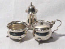 Appraisal: A three piece hallmarked silver cruet set comprising an open