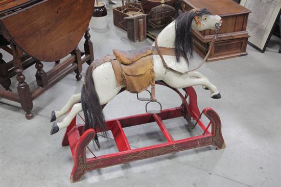 Appraisal: CHILD'S ROCKING HORSE Carved and and polychrome painted wooden rocking