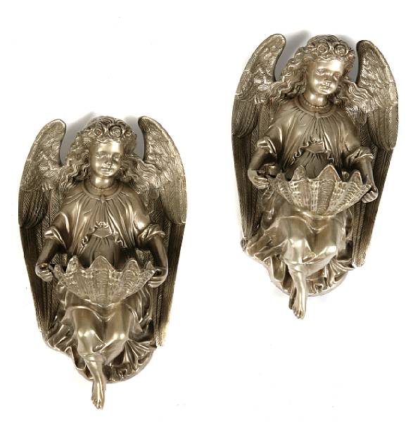 Appraisal: A pair of silvered bronze figural angel form wall fonts