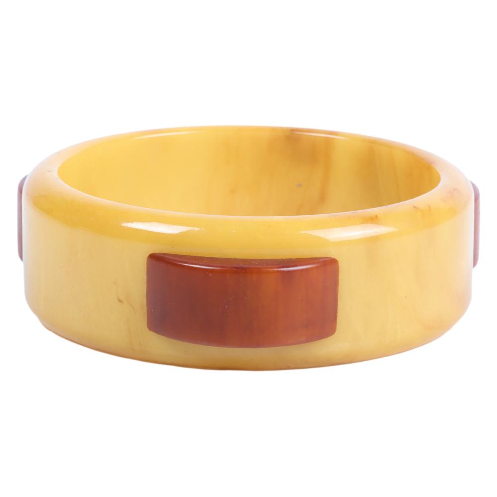 Appraisal: BAKELITE CREAM BANGLE BRACELET WITH RAISED BROWN SEMI-CIRCLE LAMINATES INNER