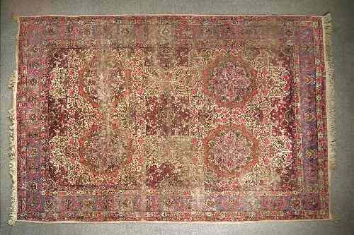 Appraisal: An early th Century Kerman carpet woven in colours with