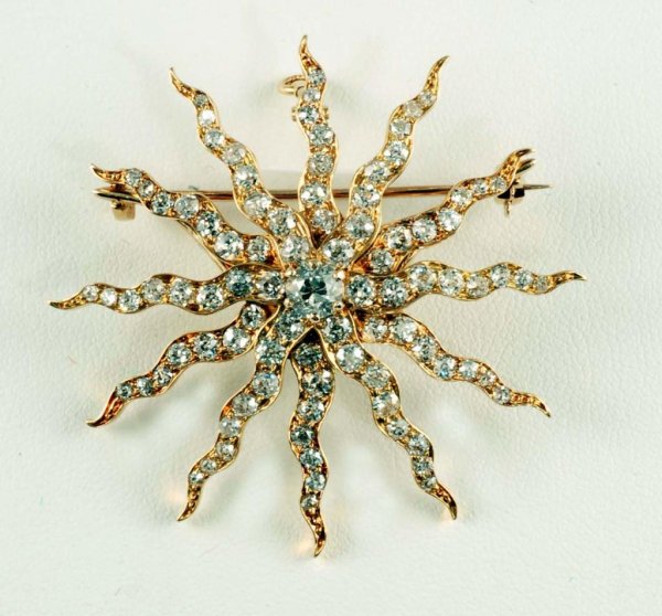 Appraisal: Diamond sunburst brooch pendant in K yellow gold Center carat