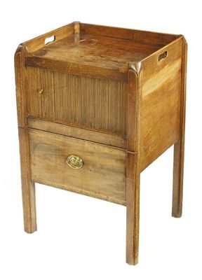 Appraisal: A mahogany 'tray top' bedside commode with pierced handgrips above