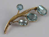 Appraisal: A yellow metal tests carat gold aquamarine and diamond brooch