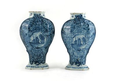 Appraisal: A pair of Dutch Delft octagonal baluster vases each painted