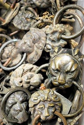 Appraisal: A QUANTITY OF LION MASK RING HANDLES of varying sizes