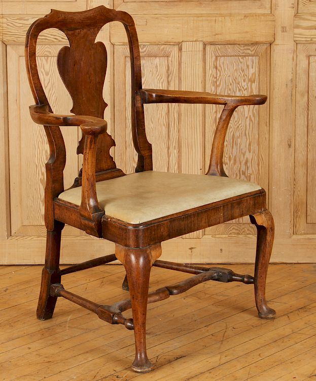 Appraisal: ENGLISH WALNUT QUEEN ANNE UPHOLSTERED ARM CHAIR An English walnut