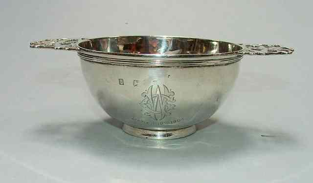 Appraisal: A LATE VICTORIAN SILVER PORRINGER with pierced handles and reeded