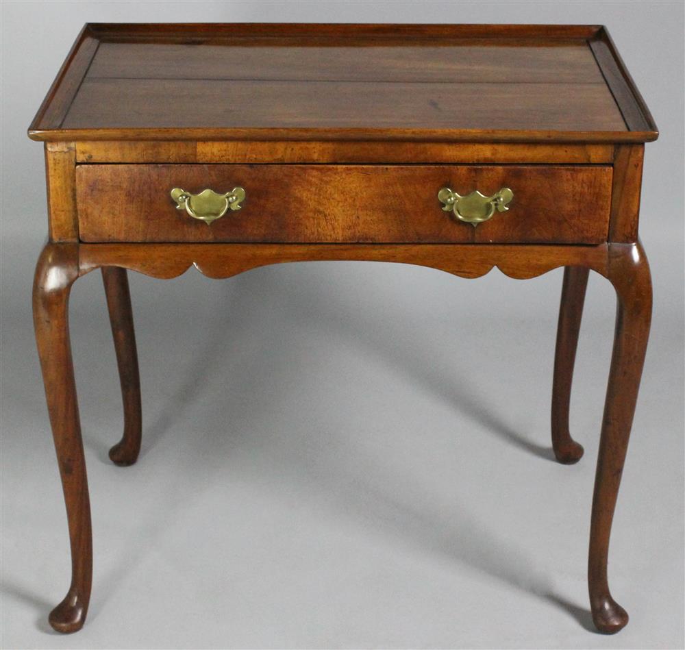 Appraisal: QUEEN ANNE STYLE MAHOGANY TEA TABLE the rectangular top with