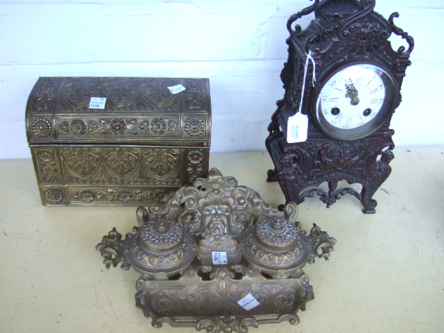 Appraisal: A bronze cased mantel clock a brass two recess inkwell