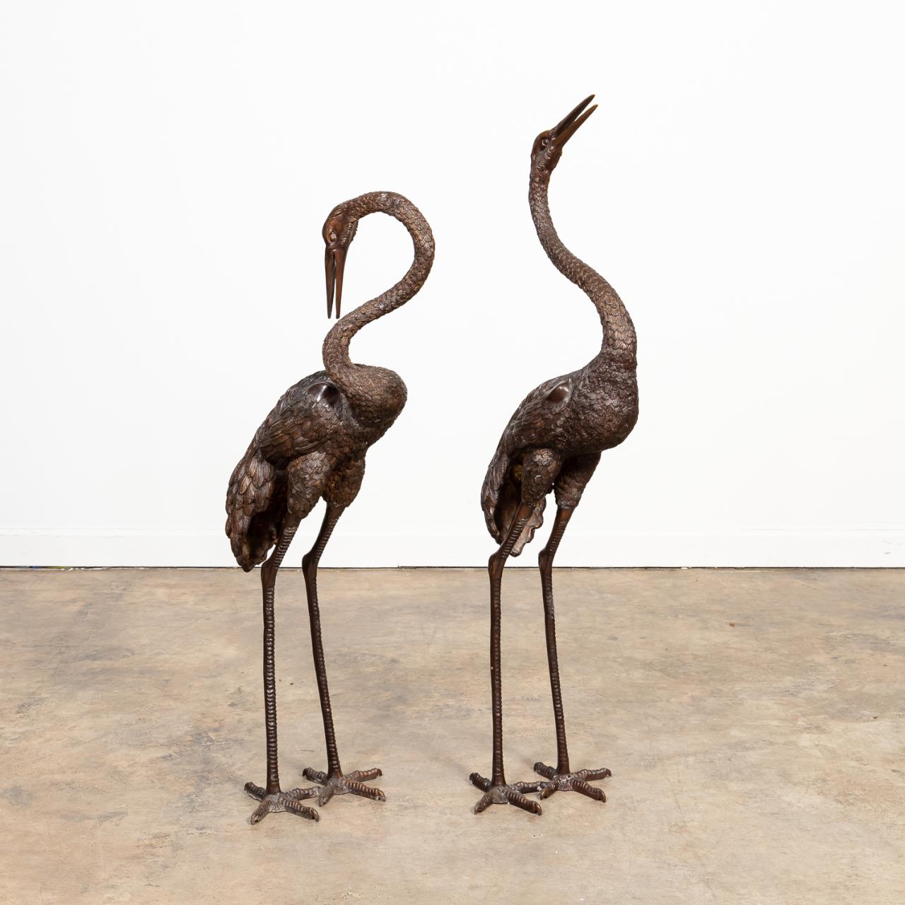 Appraisal: PAIR OF BRONZE STANDING CRANE FIGURES Pair of patinated bronze