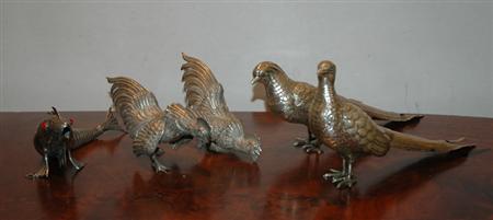 Appraisal: Pair of Continental Silver Pheasants Together with a Continental Silver