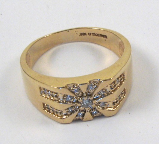 Appraisal: MAN'S DIAMOND AND TEN KARAT GOLD RING centering a round-cut