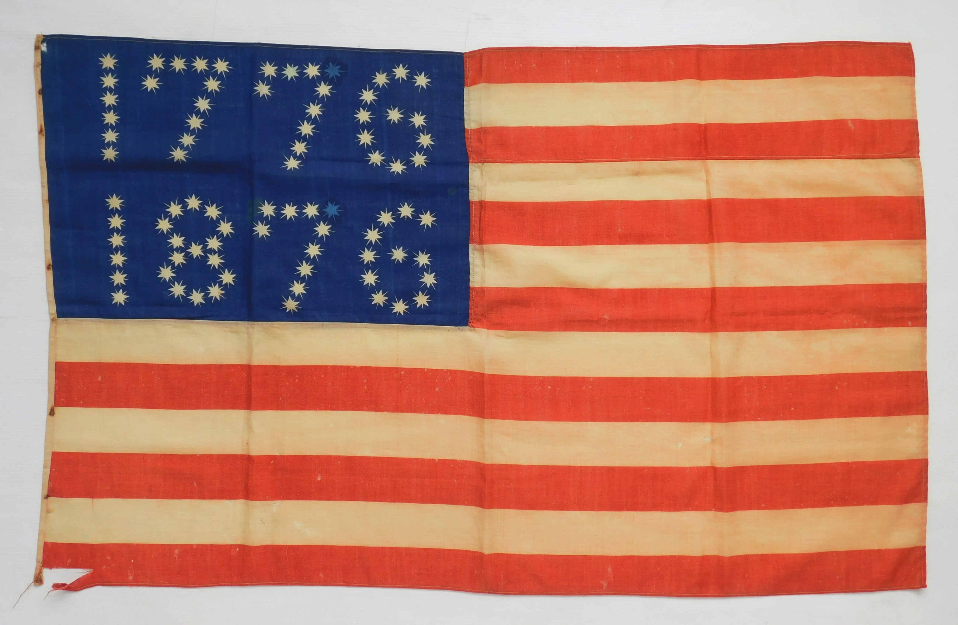 Appraisal: Centennial flag banner the canton has the dates - composed