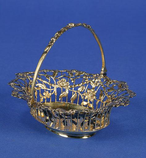 Appraisal: A GEORGE III SILVER SWEETMEAT BASKET of oval form the