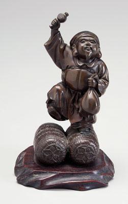 Appraisal: Japanese bronze figure of Daikoku standing on two bales of