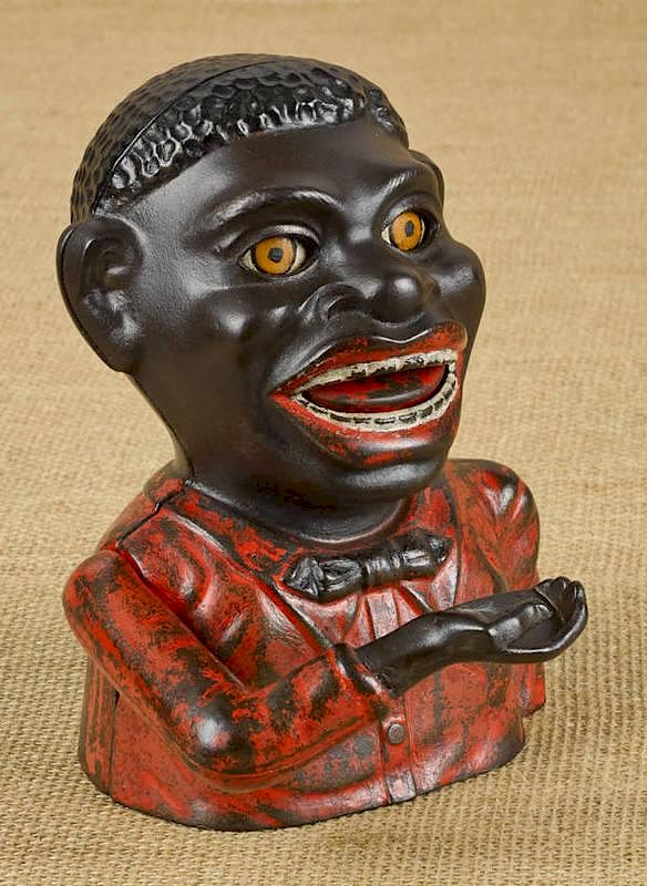 Appraisal: Cast iron Jolly black man mechanical bank made Cast iron