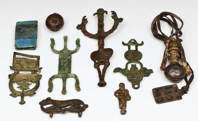 Appraisal: AN ETHNIC BRONZE TOTEM of stylised form together with a