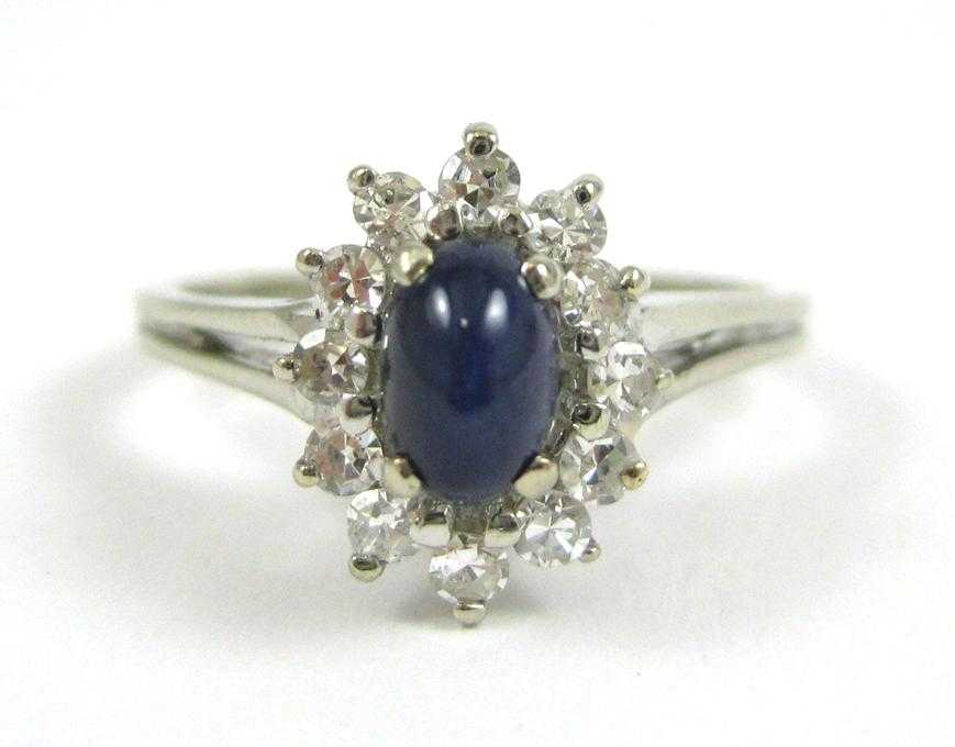 Appraisal: SYNTHETIC STAR SAPPHIRE AND DIAMOND RING The k white gold