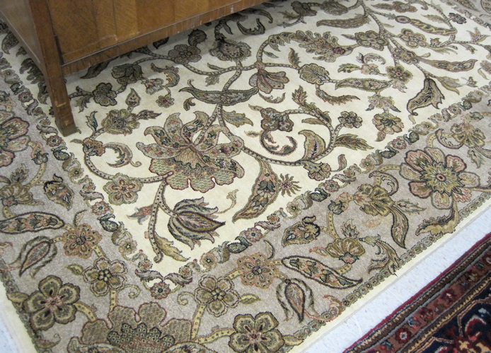 Appraisal: HAND KNOTTED ORIENTAL CARPET Pakistani Persian overall floral decoration on