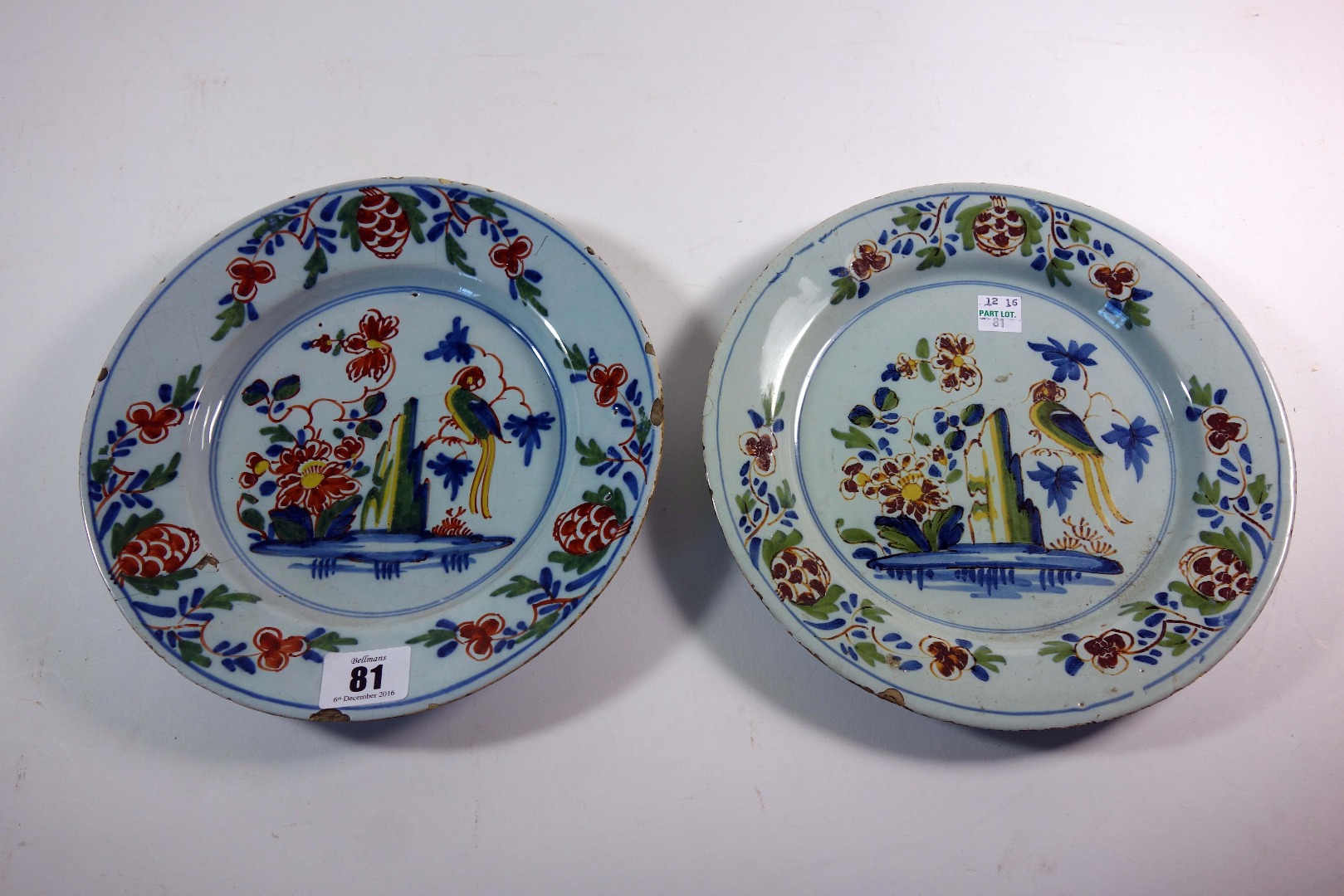 Appraisal: Two Lambeth polychrome delftware plates circa each painted with a