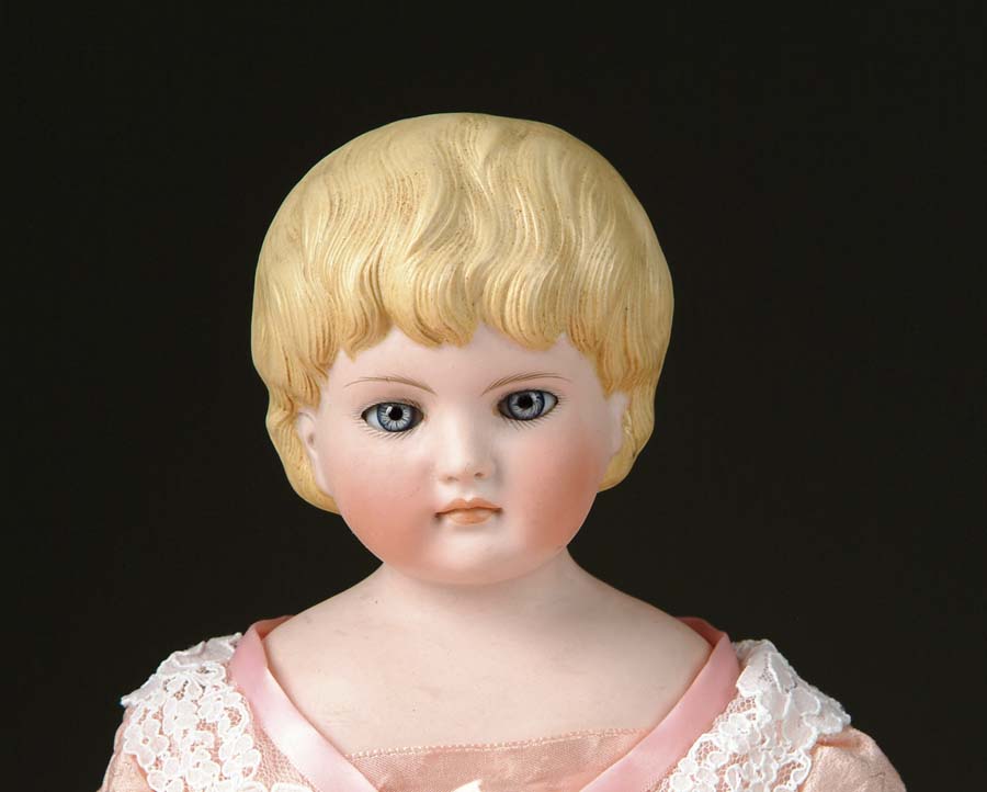 Appraisal: GLASS EYED BISQUE DOLL W MOLDED HAIR A young lady