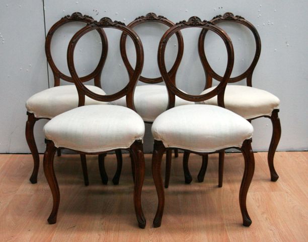 Appraisal: A set of five Victorian walnut balloon back dining chairs