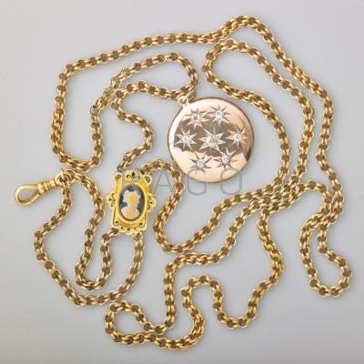 Appraisal: GOLD LOCKET AND LORGNETTE CHAIN Round locket with seven OMC