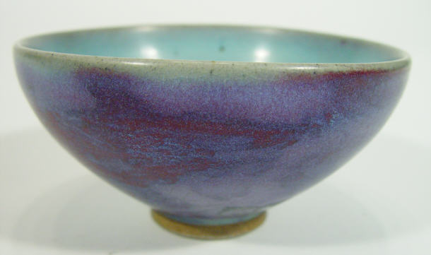 Appraisal: Chinese stoneware flared tea bowl decorated with purple flambe style