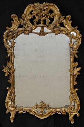 Appraisal: LOUIS XV CARVED GILTWOOD MIRROR The painted frame carved with