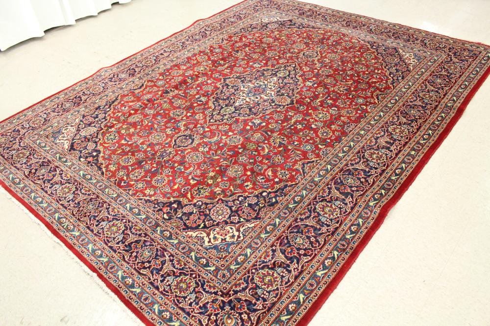 Appraisal: HAND KNOTTED PERSIAN CARPET floral and central floral medallion design