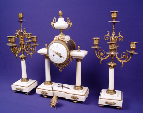 Appraisal: WHITE MARBLE CLOCK GARNITURE SET Marble base and columns with