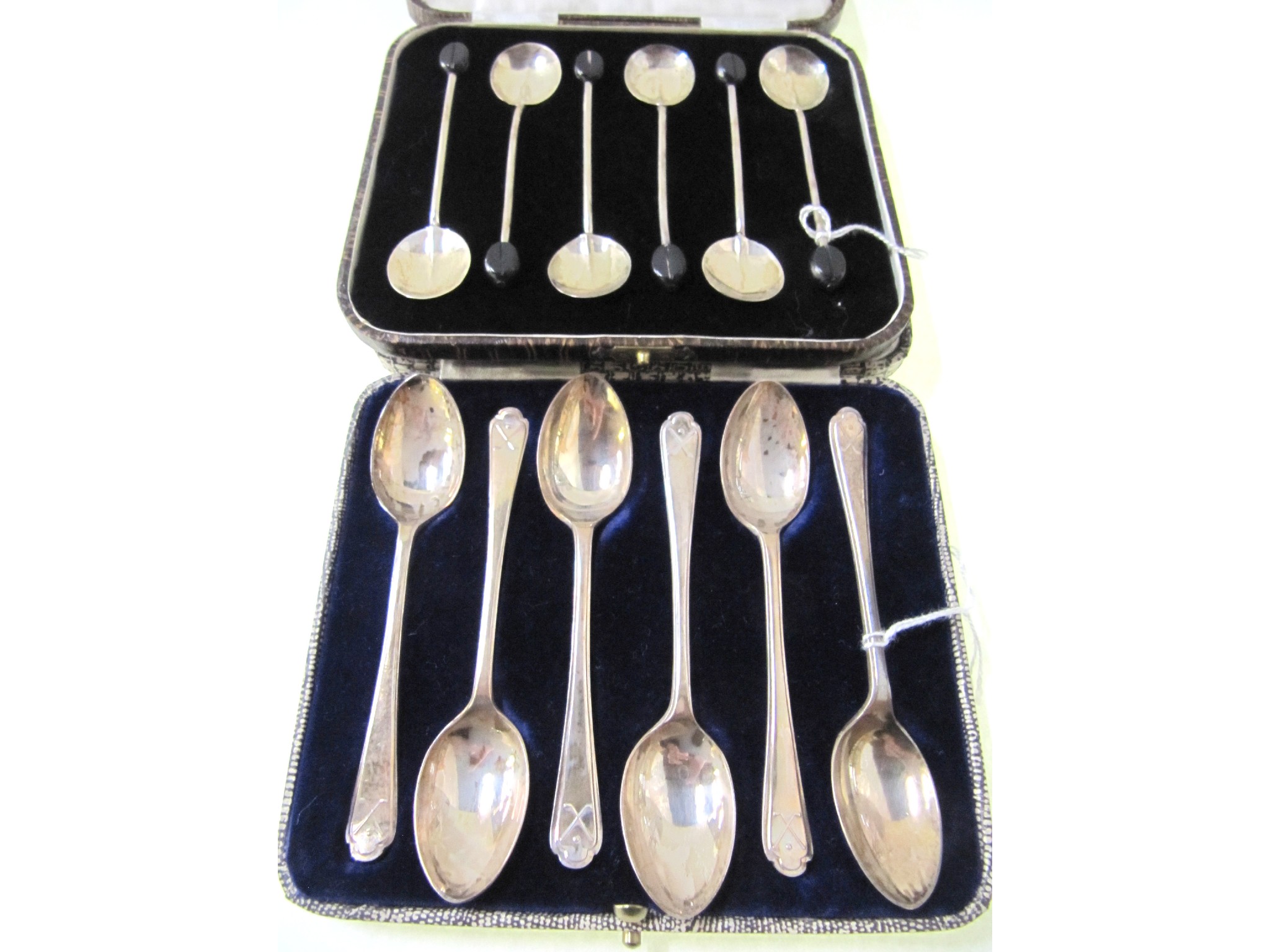 Appraisal: A lot comprising two cased sets of six silver coffee