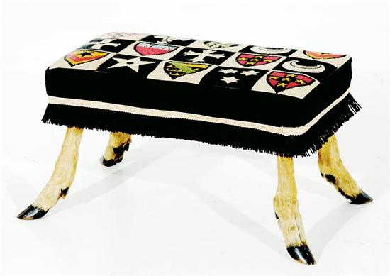 Appraisal: Needlepoint footstool with deer hoof legs H W D Provenance