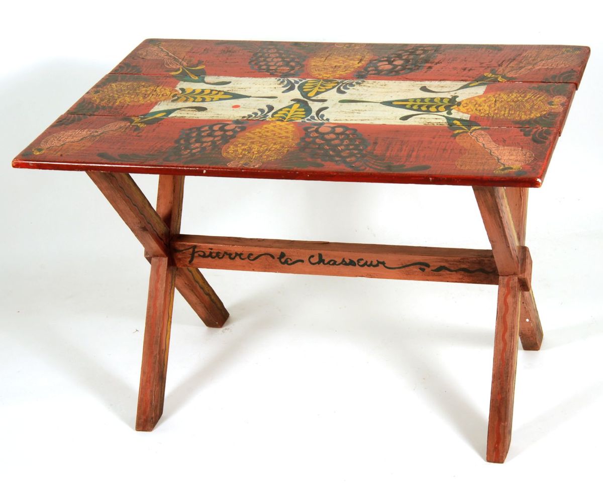 Appraisal: PETER HUNT-DECORATED SAWBUCK TABLE With stylized pineapple pear and grape