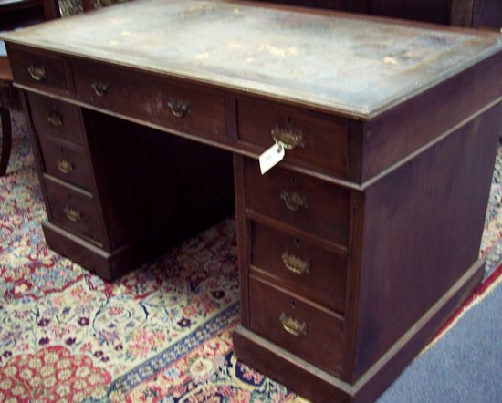 Appraisal: An early th Century pedestal desk fitted a surround of