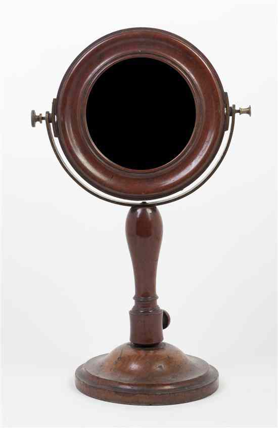 Appraisal: An American Mahogany Shaving Mirror the circular plate set in