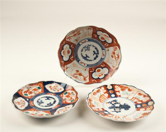 Appraisal: Three th C Imari Plates each with a fluted body