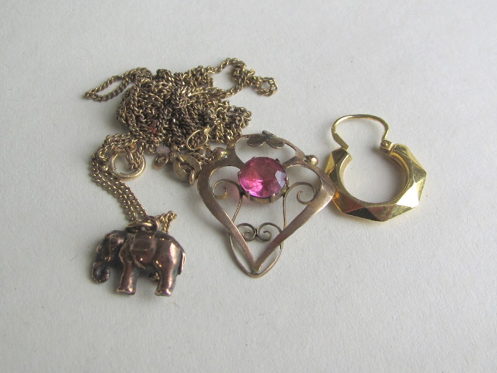 Appraisal: Lot comprising two ct gold neckchains Holbein pendant elephant pendant