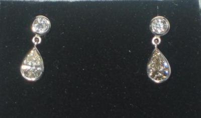 Appraisal: A PAIR OF DIAMOND DROP EARRINGS comprising a brilliant cut