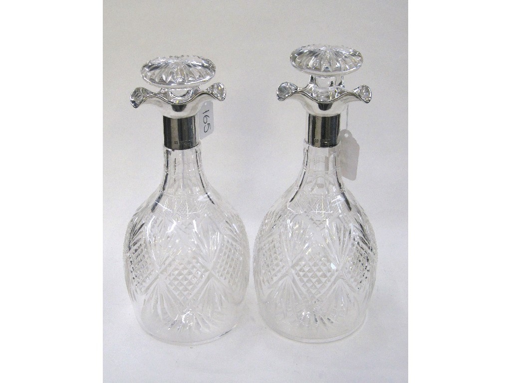 Appraisal: Pair of silver mounted decanters Sheffield