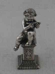 Appraisal: A white metal tests silver model of a putto playing