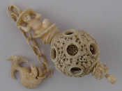 Appraisal: A Chinese ivory puzzle ball finely carved as at least